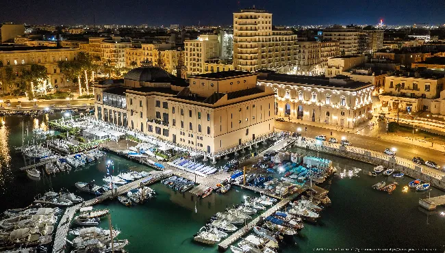 Margherita Theatre at night: an aerial view of Bari's old harbour