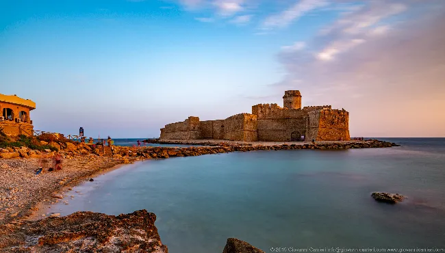 The beach in front of the Aragonese Castle of Le Castella