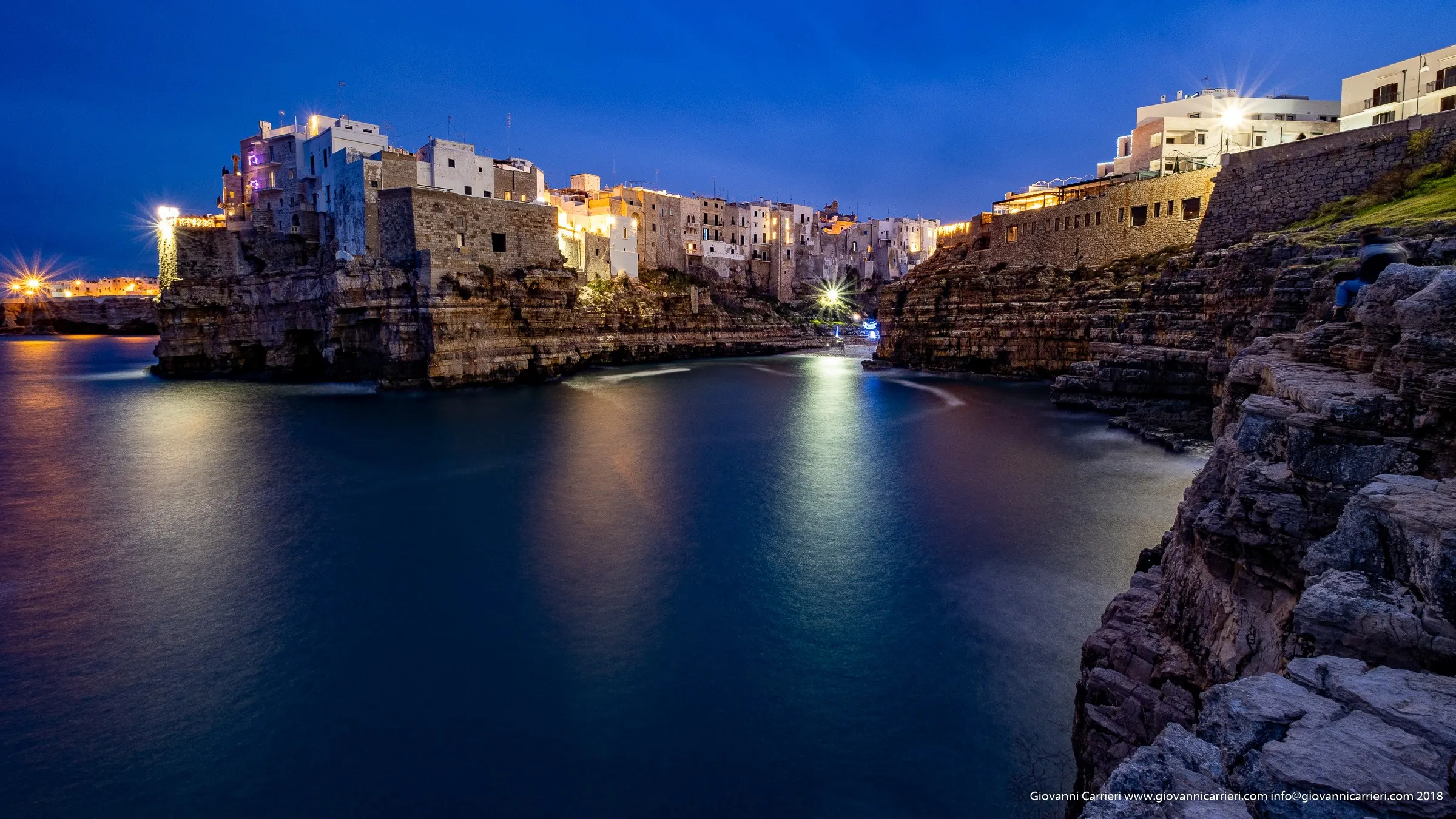 The beach of Cala Monachile seen from the cliff in front