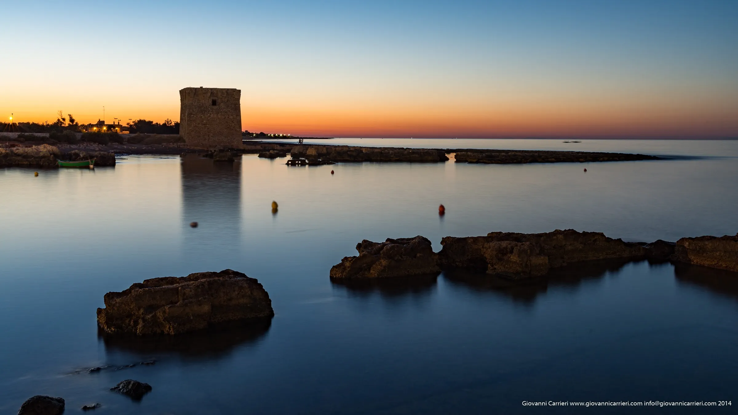 A sunset lights up San Vito, a village of Polignano a Mare