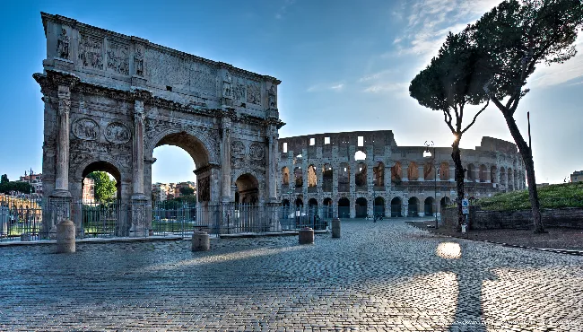 The Arch of Constantine and the Colosseum at dawn