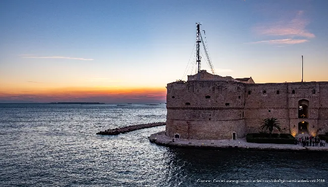 Glimpse of the Aragonese castle at sunset