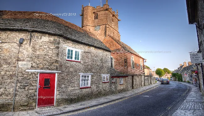 Corfe Castle village street with the church