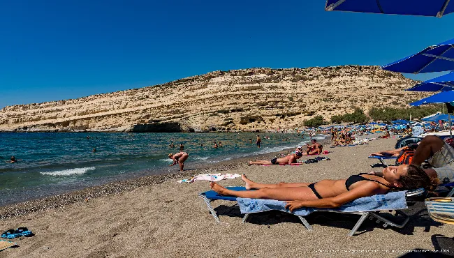 Matala beach with caves in the cliff