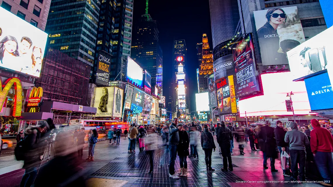 Times Square is a major commercial intersection and a neighborhood in Midtown Manhattan, New York City, at the junction of Broadway (now converted into a pedestrian plaza) and Seventh Avenue and stretching from West 42nd to West 47th Streets.