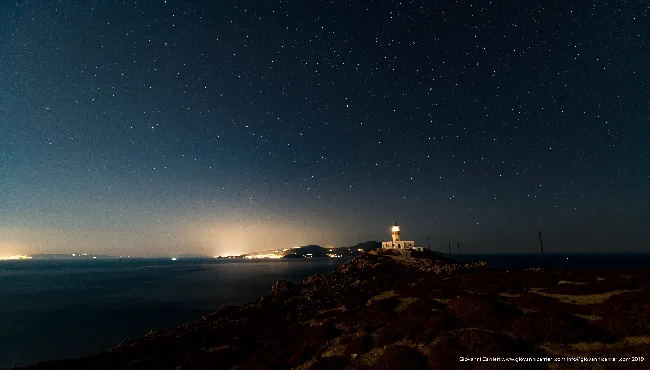 Armenistis lighthouse under the starry sky