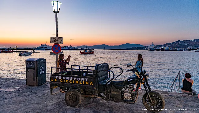 "La Cicciolina" three-wheeler on the waterfront at sunset