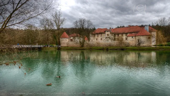 The Otocec castle seen from one shore of the river Krka - Slovenia