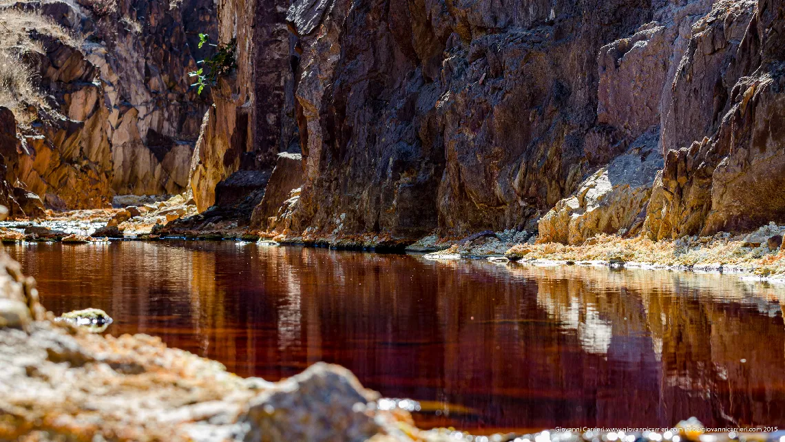 Rock and red water